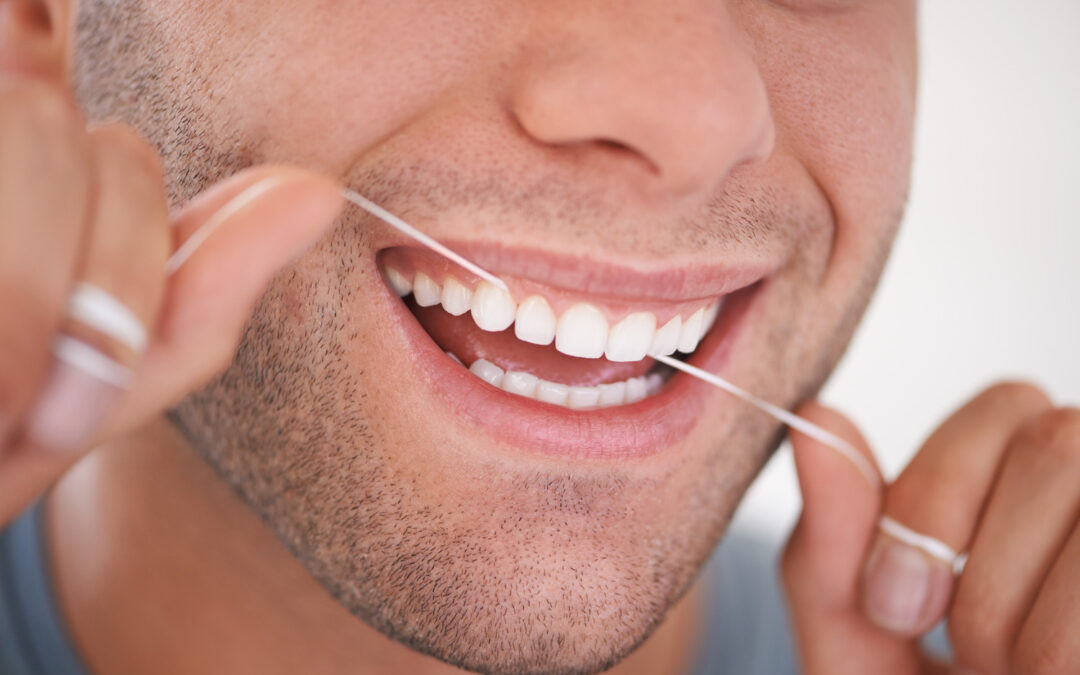 Man flosses his teeth in Waterville and Winthrop ME